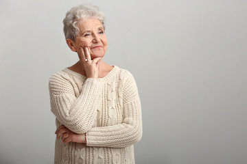 Wall Mural - Portrait of senior woman on white background