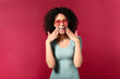 © Pixel-Shot - Happy African-American woman on color background