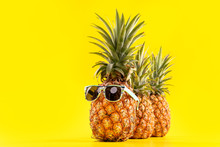 Creative Pineapple Looking Up With Sunglasses And Shell Isolated On Yellow Background, Summer Vacation Beach Idea Design Pattern, Copy Space Close Up