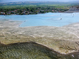 Fototapeta  - Pamukkale, Turkey(4). Water jets coming from the ancient city of Hierapolis, rich in mineral salts, falling from a great height, creating whimsical, petrified, dazzling white Cascades