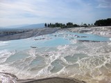 Fototapeta  - Pamukkale, Turkey(5). Water jets coming from the ancient city of Hierapolis, rich in mineral salts, falling from a great height, creating whimsical, petrified, dazzling white Cascades