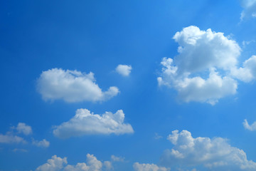 Wall Mural - white clouds with blue sky background.