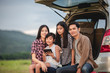 © tuiphotoengineer - Happy little girl  with asian family sitting in the car for enjoying road trip and summer vacation in camper van