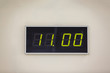 © Angelov - Black digital clock on a white background showing time 11.00