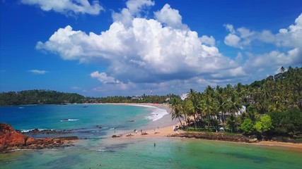 Wall Mural - Aerial view of the tropical sandy beach in the town of Mirissa. Sri Lanka