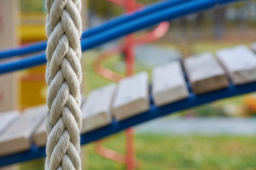 Wall Mural - White rope cable for climbing on playground for children.