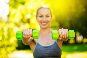 Young slim fitness woman doing fitness activity