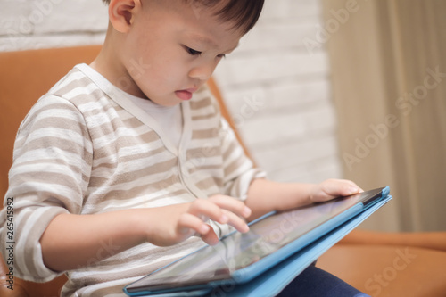 Confused Aggressive Asian 2 3 Years Old Toddler Boy Child Using Tablet Pc Playing Game While Waiting For His Flight At Airport Lounge Gadget Addicted Children Traveling With Kid Concept Stock Photo