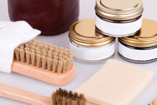 Cream, Brushes And Napkin For The Care Of Shoes. Shoe Care Products. Shoe Cosmetics Close-up.