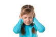 Blonde caucasian young girl closing ears with hands, suffering from noise. Isolated over white background