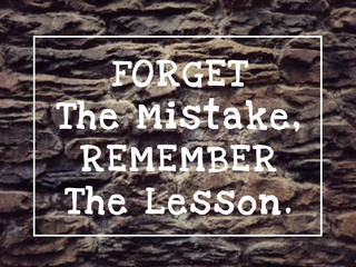 Wall Mural - Motivational and inspirational quote - Forget The Mistake, Remember The Lesson. Blurred styled background.