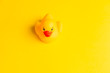 Rubber duck on yellow background minimal creative concept with text space, baby bath