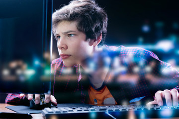 young cyber sportsman training hard late at night berfore the championship, palying games b