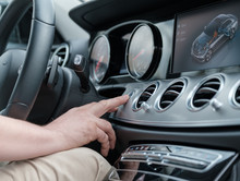 Man Testing Additional Car Control At Luxury Car