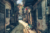 Fototapeta Uliczki - Around chinese hutongs in Guangzhou city, which are a type of narrow streets or alleys in typical neighborhoods with old houses.    