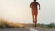 © sutadimages - Athlete runner feet running on road, Jogging concept at outdoors. Man running for exercise.