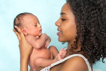 tender african mother with baby