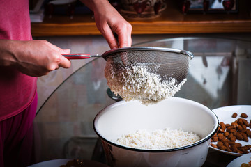 The process of making traditional Easter molded cottage cheese dessert paska.