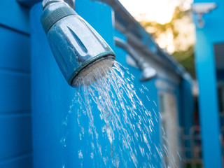 shower in outdoor near swimming pool.