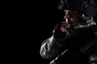 © zorandim75 - Soldier special forces with rifle on dark background