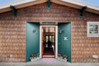 © Mint Images - Open front door of wooden house