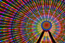 Spinning Ferris Wheel Illuminated At Night