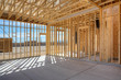 © Mint Images - Construction of house under blue sky