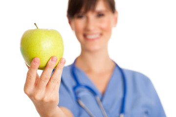 Wall Mural - Happy Nurse Holding Green Apple - Healthy Eating Food