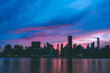 New York City skyline silhouette during colorful sunset