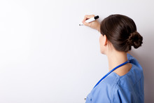Nurse Writing On Whiteboard - Blank For Text - Medical Healthcare