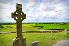 Celtic Cross Over A Field In Ireland