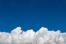 Background, Clear Blue Sky And White Cumulus Fluffy Clouds On The Bottom Edge