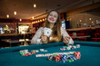 © RomanR - Woman in casino showing combination of aces
