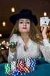 © RomanR - Beautiful woman in casino with colorful chips