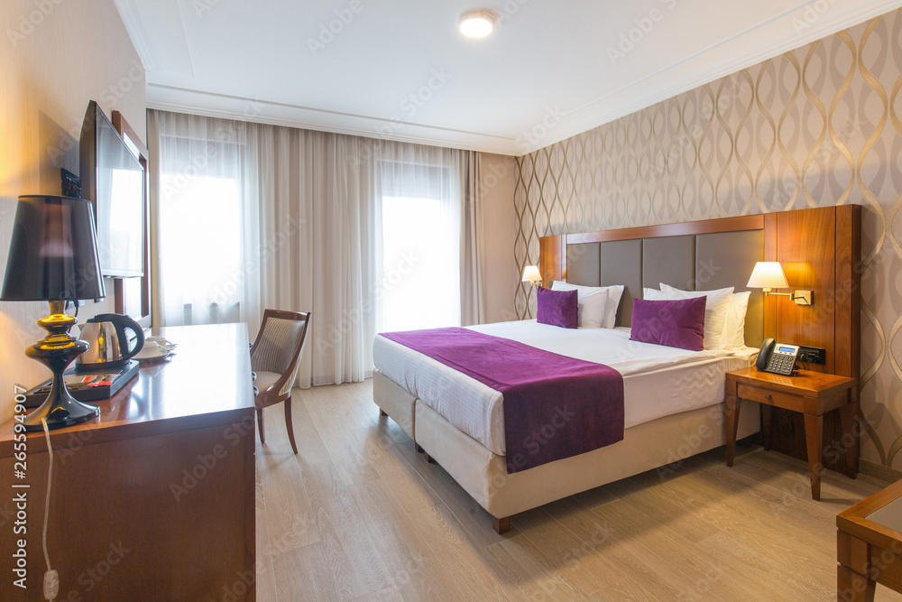 Luxury double bed hotel bedroom interior - obrazy, fototapety, plakaty 