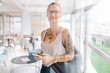 © Criene Images - portrait of tattooed business woman