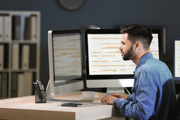 Male programmer working in office