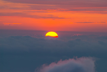 Wall Mural - Sunset behind the clouds