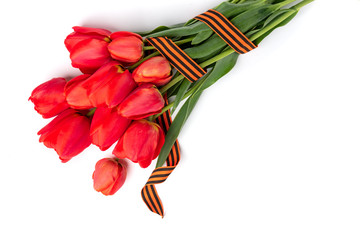 Wall Mural - Red tulips with St. George ribbon isolated on white background. Victory day or Fatherland defender day. 