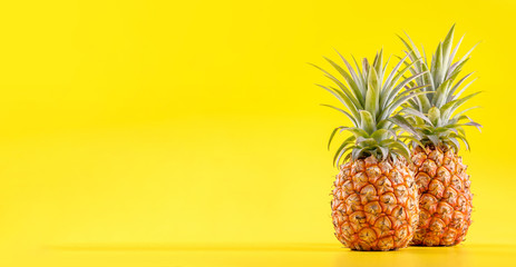 Wall Mural - Beautiful fresh pineapple isolated on bright yellow background, summer seasonal fruit design idea pattern concept, copy space, close up