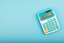 Close-up And Selective Focus Shot, Calculator On Blue Background. Copy Space For Text