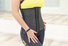 Girl In A Corset And Sports Leggings, Hands On Hips