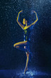© master1305 - Young female ballet dancer performing under water drops and spray. Caucasian model dancing in neon lights. Attractive woman. Ballet and contemporary choreography concept. Creative art photo.