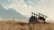 An Old Wooden Two-wheeled Cart Sits Forlornly In An Overgrown Field. Its Wood Is Rotting And Its Iron Rusting. Pine Covered Hills Rise In The Hazy Distance And The Autumn Grass Is Brown. 3D Rendering