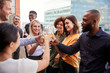 © Monkey Business - Creative business colleagues raising glasses and making a toast with drinks after work