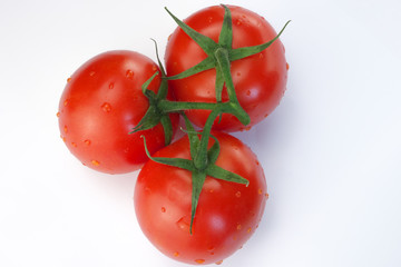 Three red ripe tomatoes