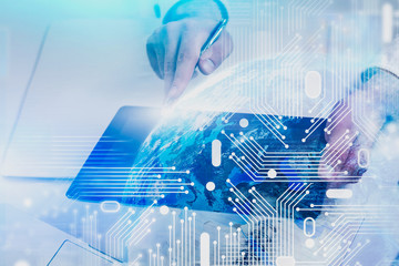 Poster - Man hand using tablet with circuit, digital planet
