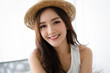 © edward_indy - Portrait of a Asian woman in a hat, closeup portrait of a nice female in summer straw hat and looking at camera. Concept woman lifestyle, happy korean or japanese girl healthy summer vacation.