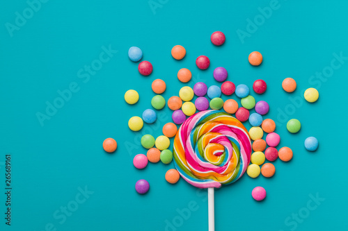 Sweet lollipop and colorful chocolate candy pills. Poster Mural XXL