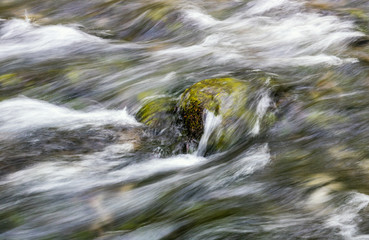 water flowing over the rock